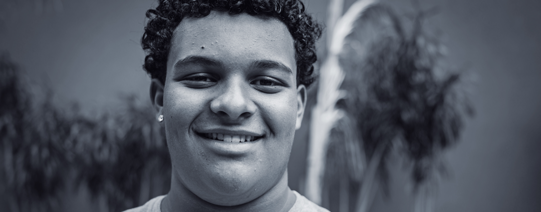 Teenage boy smiling at camera