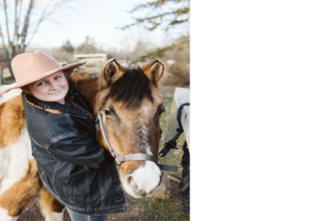 Raya is pictured hugging a horse around its neck