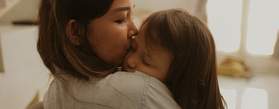 Mothing Kissing Child