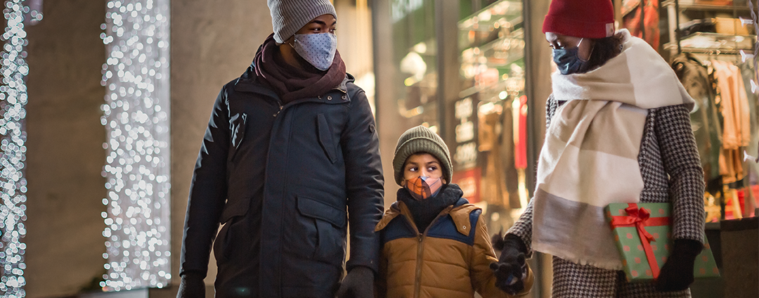 Parents taking son holiday shopping 