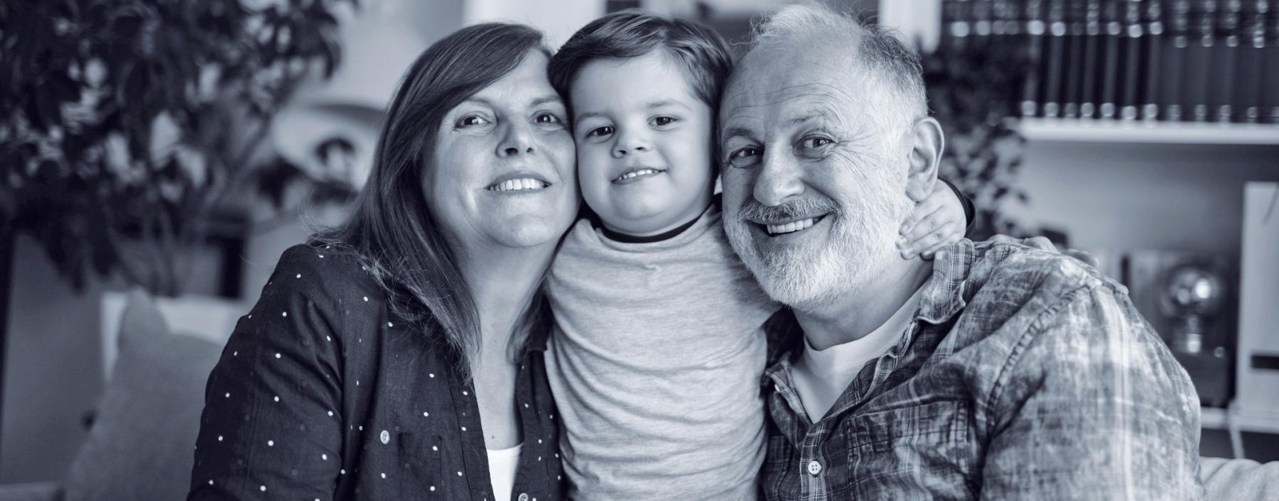 photo of an older couple with a younger boy