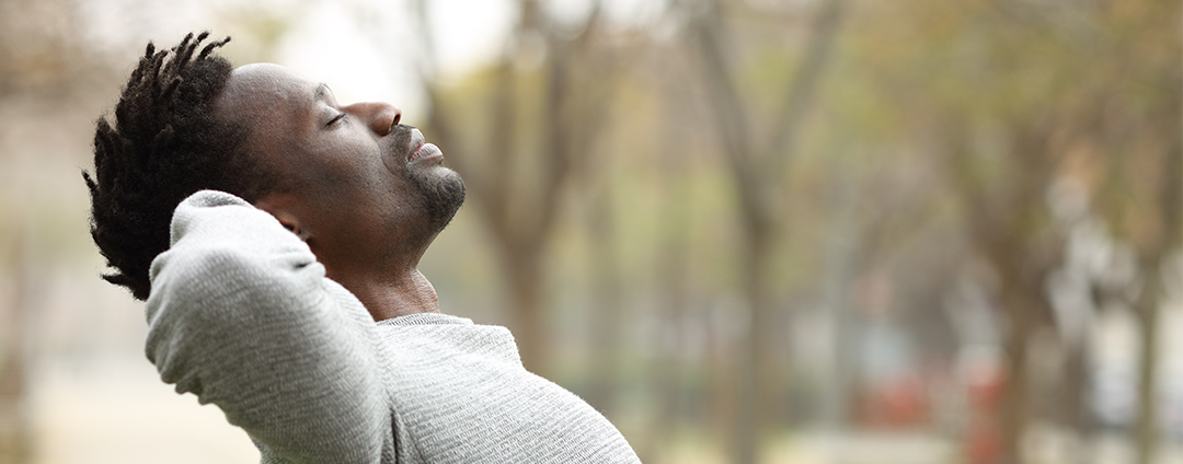 Man taking a breath in the park