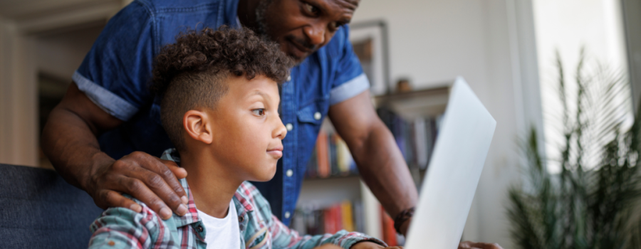 Parent and teen on the computer together