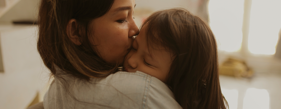 Mothing Kissing Child