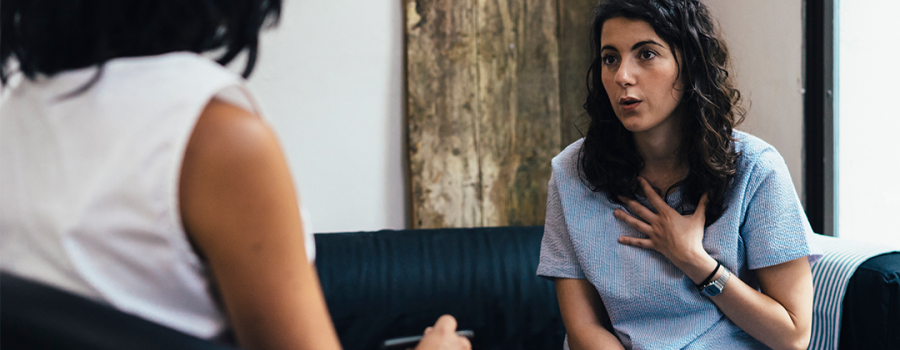 a woman talking in a therapy session