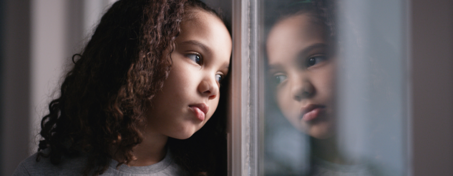 Child looking out a window.