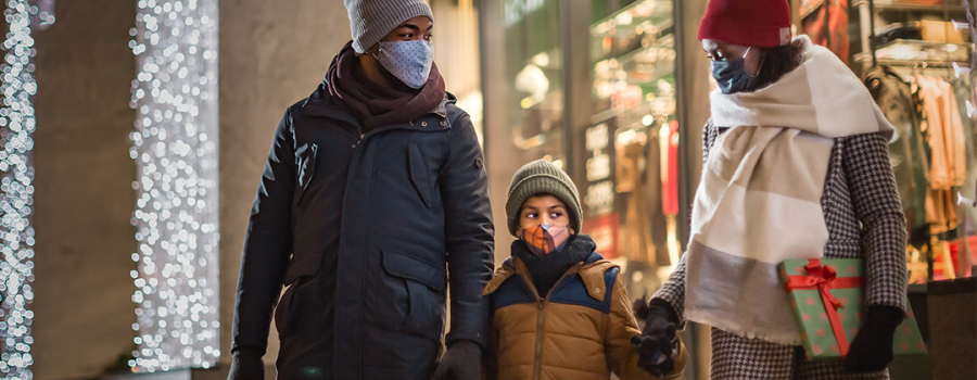 Parents taking son holiday shopping 