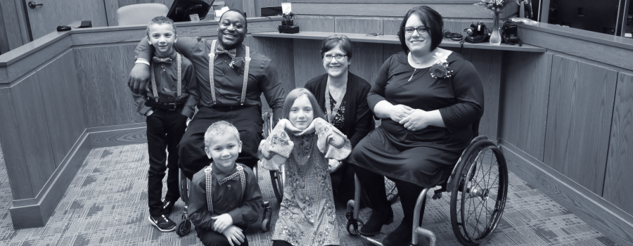 Anna and Master Kinkle at the adoption ceremony with their three kids