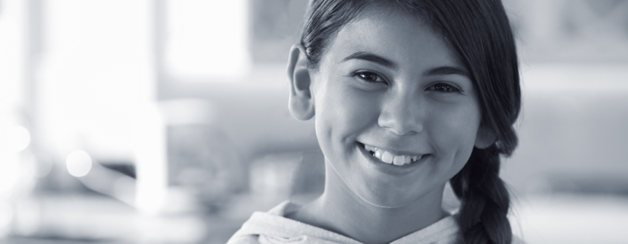 A young girl smiling