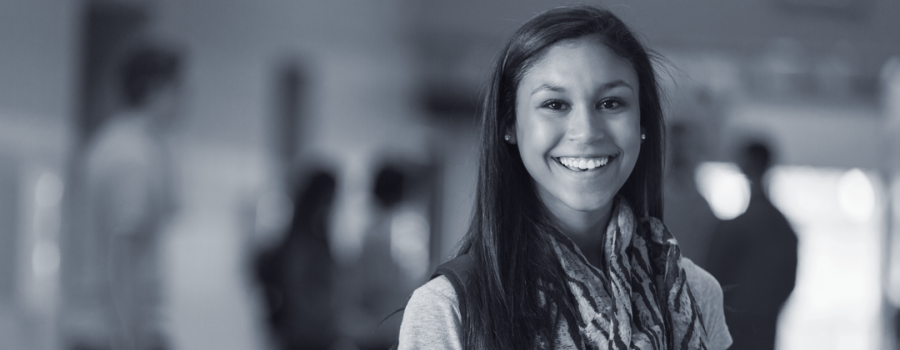 Maria standing in the hallway of her high school