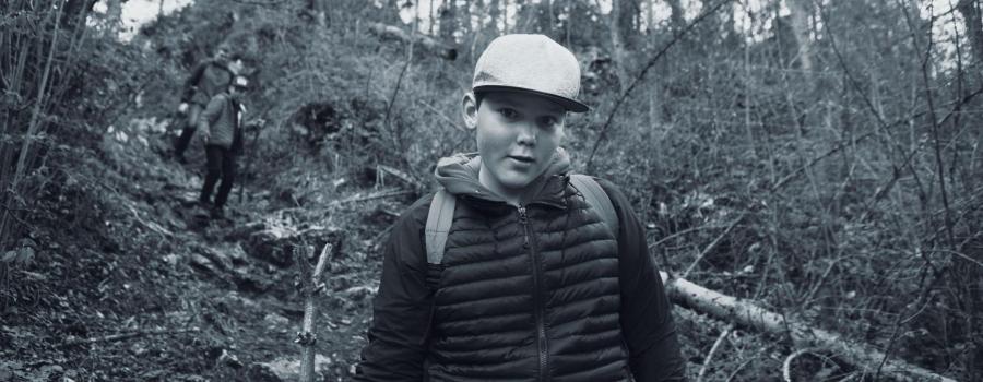 young man hiking in the woods