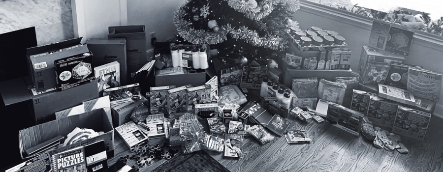 Photo of holiday gifts under a Christmas tree