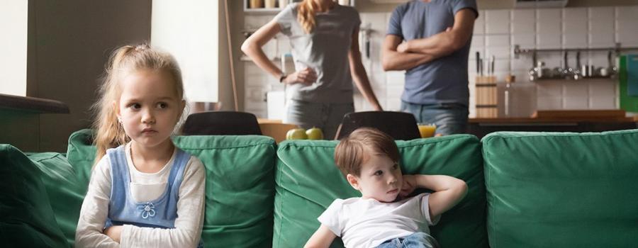 Couple arguing in front of children. 