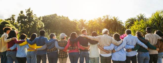 A group of individuals standing in a row with their arms linked behind their backs