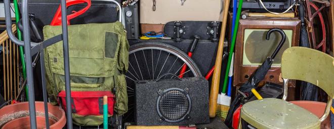 luggage and various items found and stored inside a garage