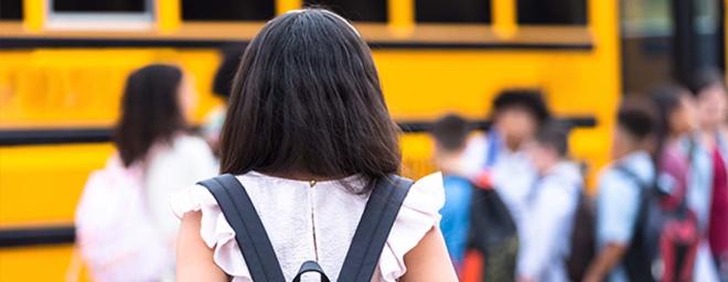 A child arriving at school.