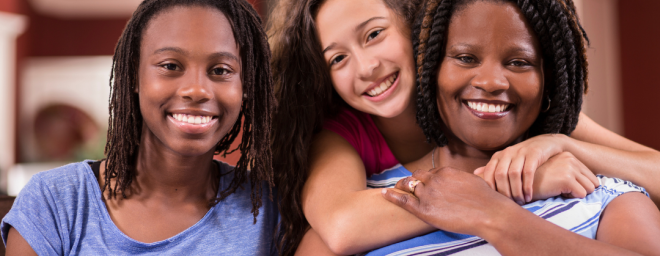 Two teenage girls with an adult female