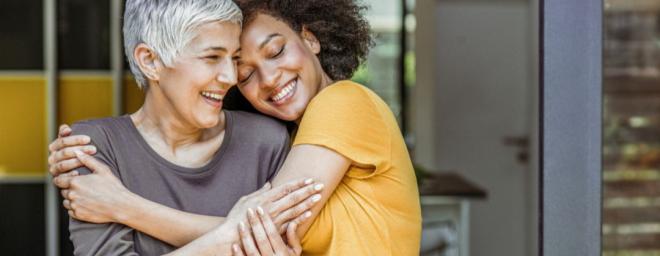 Two people hugging.