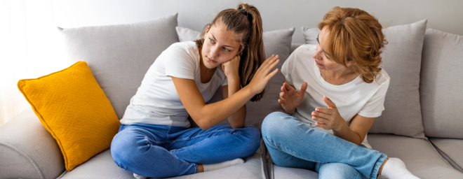 Picture of a teen daughter refusing to listen to her mother.