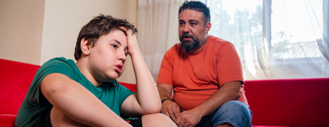 Father talking to teen son
