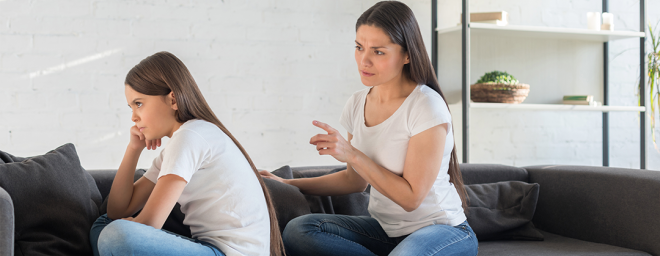 Mother and daughter arguing about control