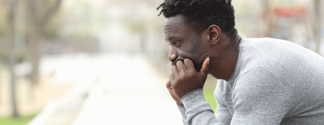 A man sitting and reflecting.