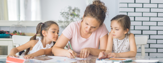 Mother helping two daughter write a crisis plan