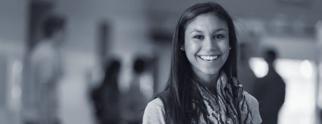 Maria standing in the hallway of her high school
