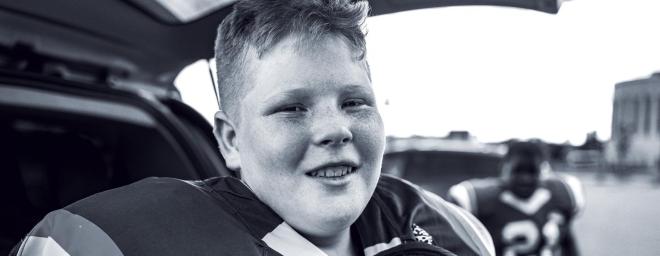 Photo of a teenage boy in football gear