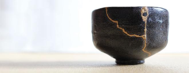 image of a broken Japanese bowl put back together with gold metals