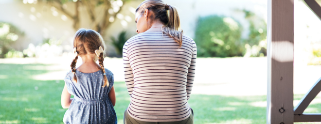 Respite - female adult sitting on a porch step and talking with a young child