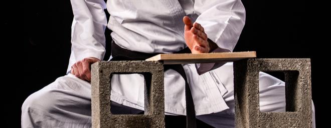 Martial Artist Breaking a Board 