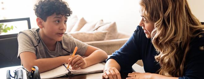 Mother helping son with school