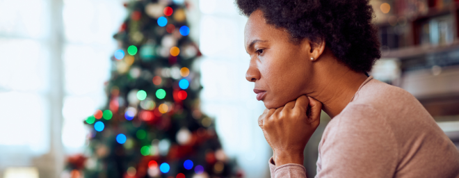 A woman sitting by herself on the holidays.