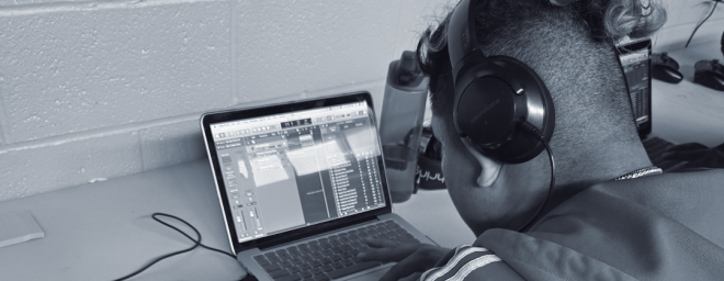 A youth using Nexus-Woodbourne's music studio equipment