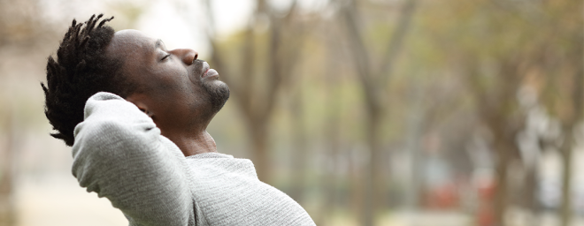 Man taking a breath in the park