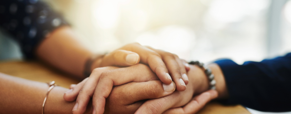 photo of two peoples' hands holding