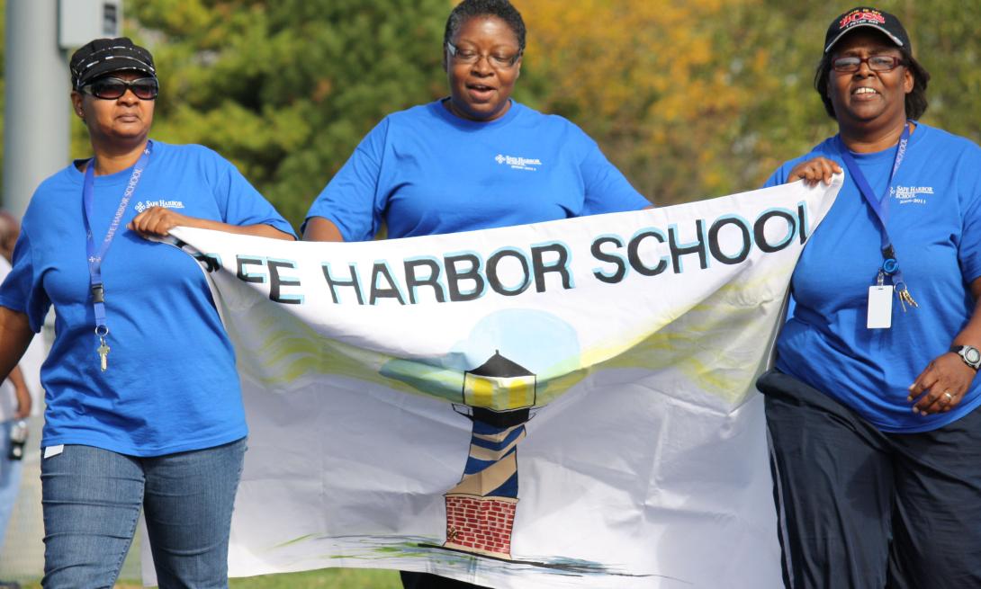 Safe Harbor staff walking in a local event.