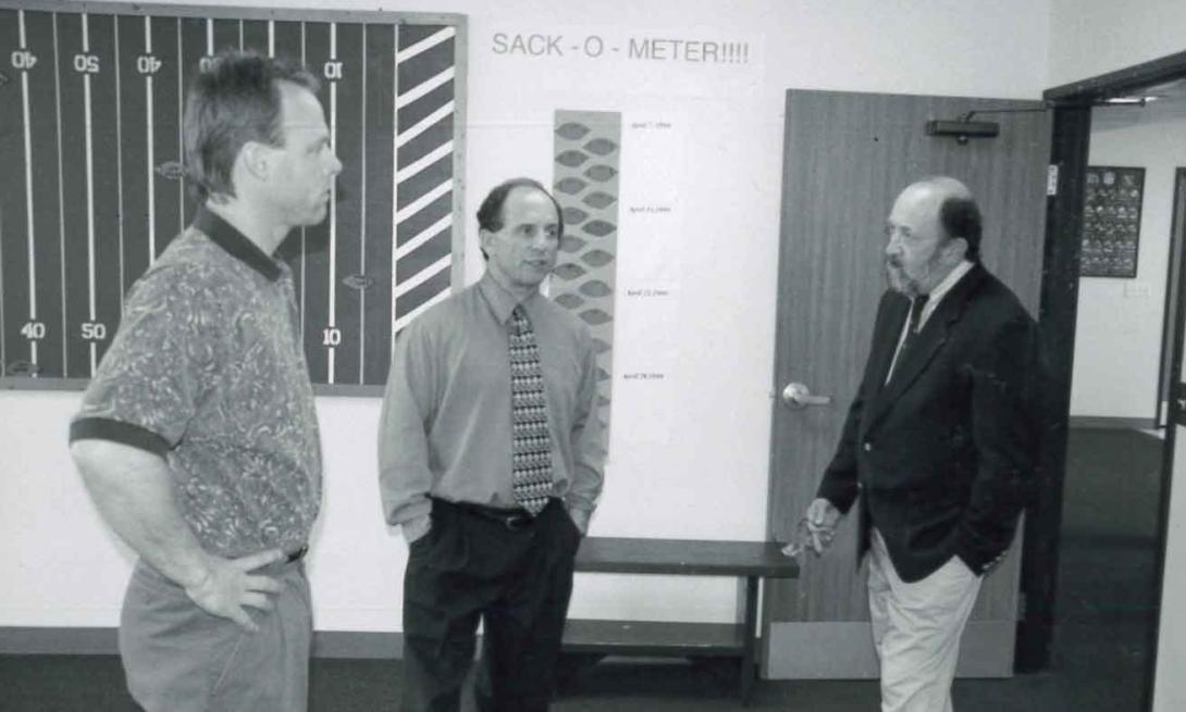 Nexus staff talking with MN Senator Paul Wellstone.