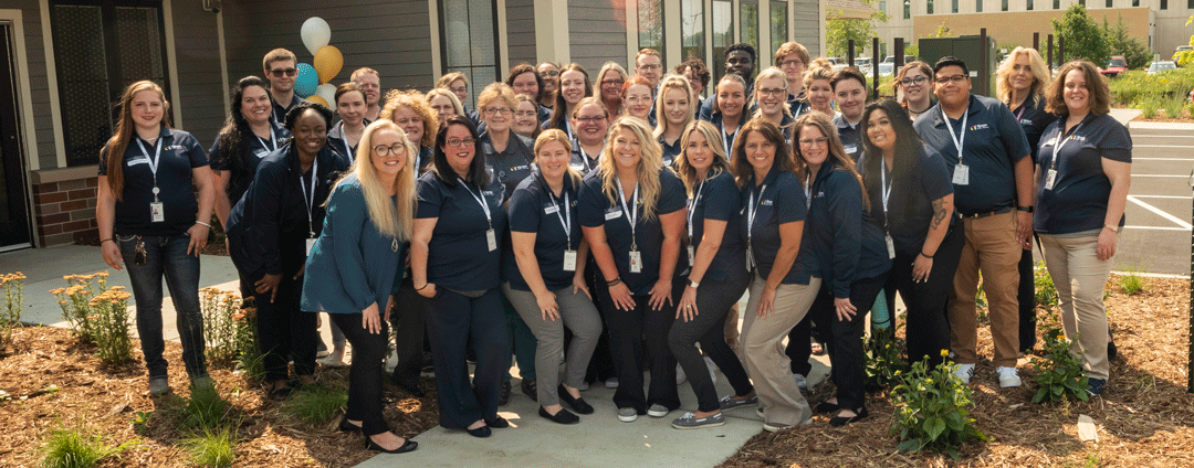 The Southeast Regional Crisis Center team outside the front of the building