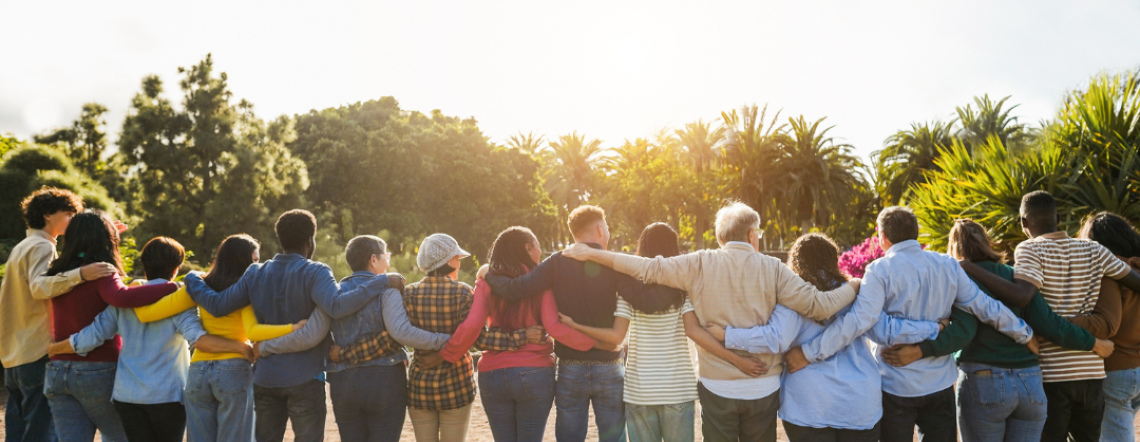 A group of individuals standing in a row with their arms linked behind their backs