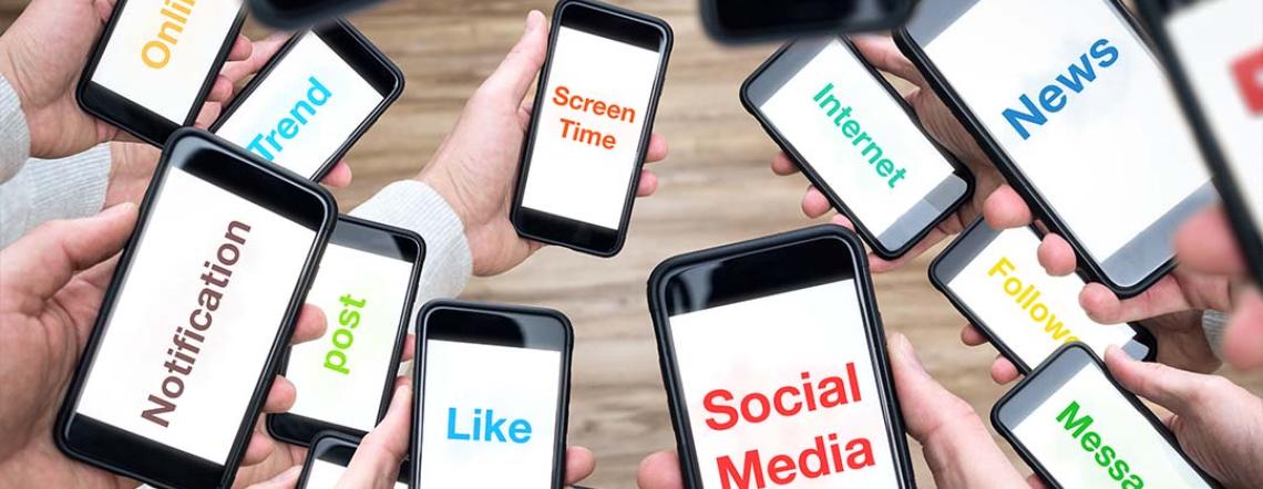 Picture of people holding their phones, displaying potential electronic clutter.