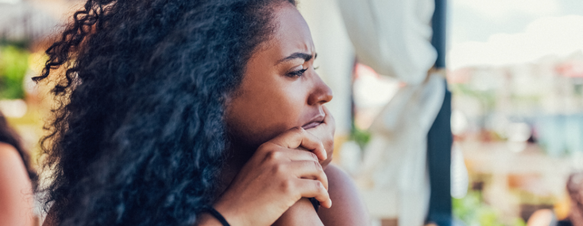 A woman who looks like she is in deep thought.