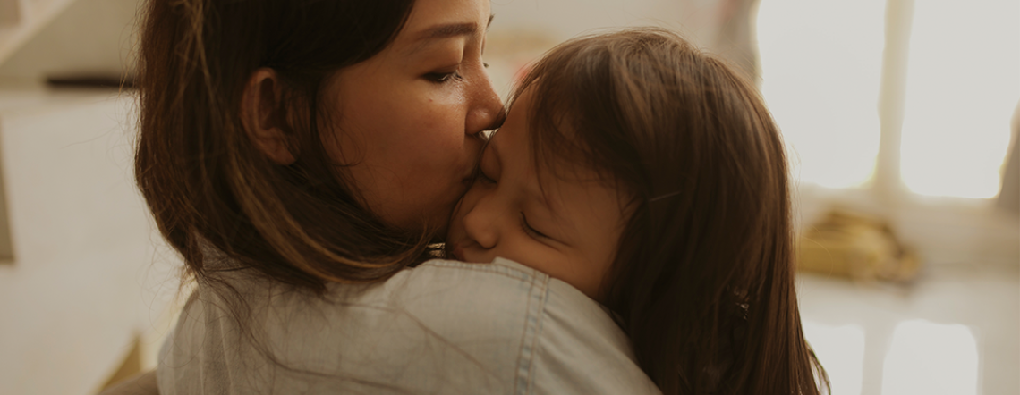 Mothing Kissing Child