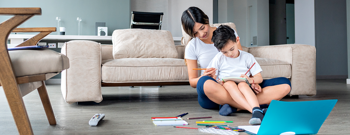 Mother doing homework with son