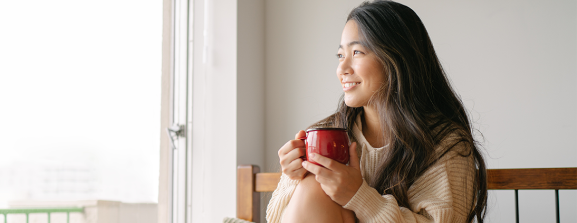 Women drinking coffee in bed
