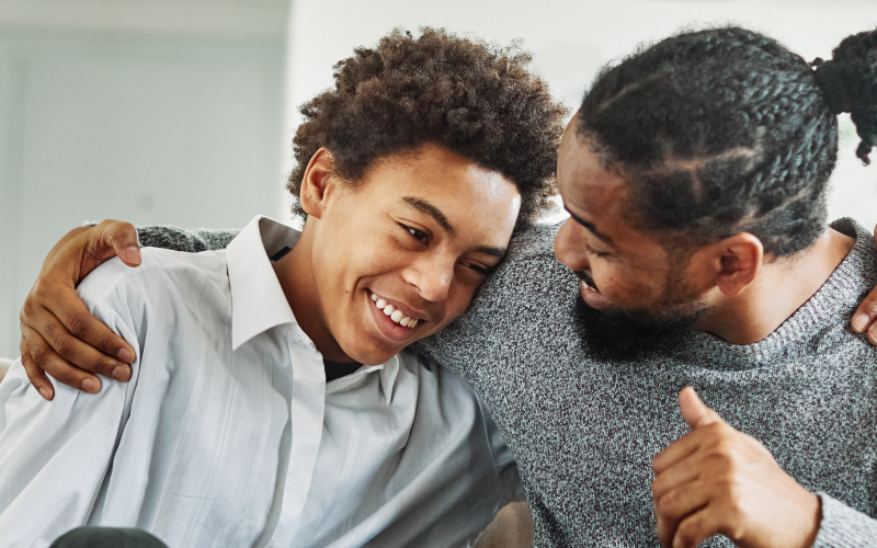 Foster parent and teen hugging