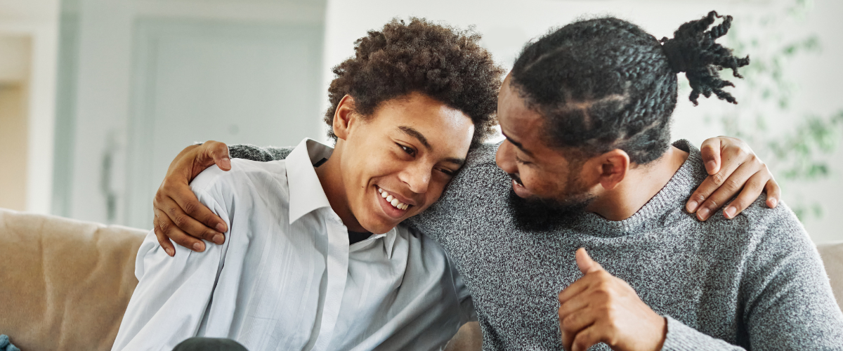 Foster parent and teen hugging