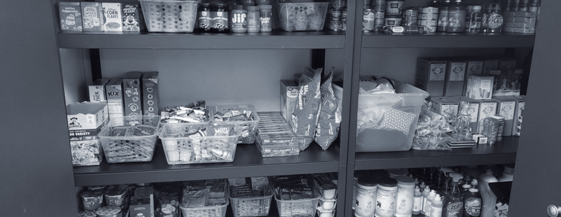 Food pantry shelf filled with items at Nexus-PATH