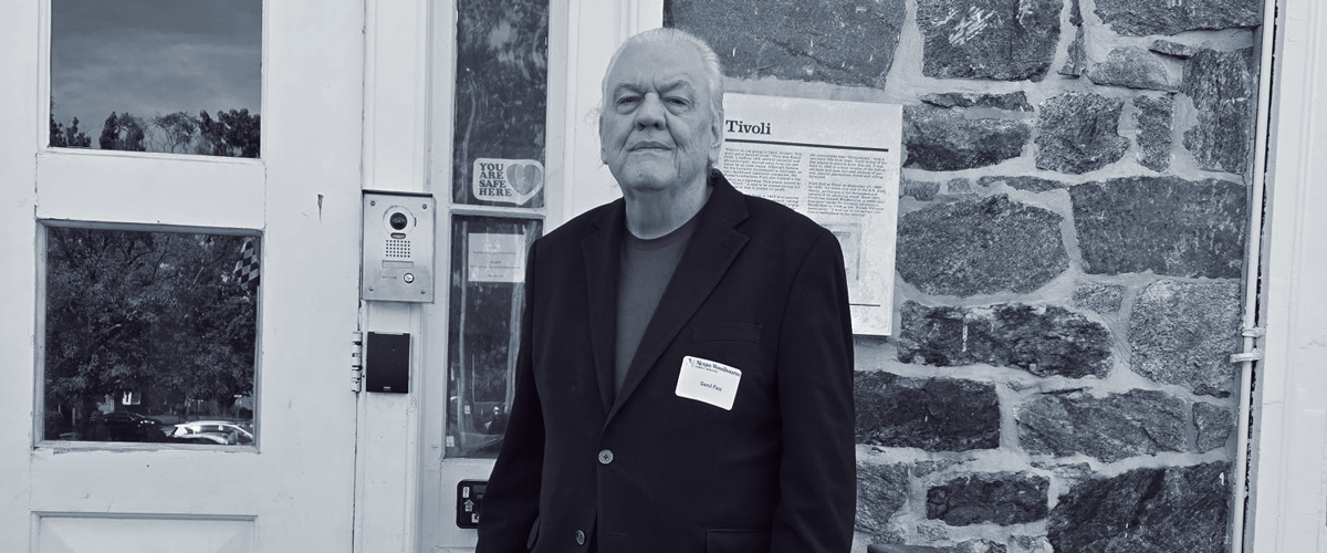 Larry standing in front of Nexus-Woodbourne campus